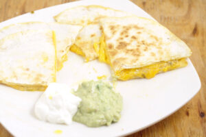 Cheese Quesadillas with Copycat Taco Bell Quesadilla Sauce tastes JUST like the original. From a former Taco Bell worker and current Taco Bell Quesadilla addict. Makes a quick and easy appetizer or dinner recipe too!